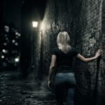Woman struggling with self-blame after abuse, symbolic image of inner darkness and healing